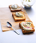 Bean crostini with chilli honey, baking paper and spoon