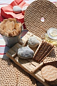 Close-up of wooden forks, bread and picnic cutlery