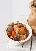 Jerusalem artichokes in red wine with beef and carrots
