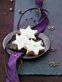 Cinnamon stars with icing and golden sugar pearls