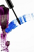 Violet and blue mascara stripes on white background