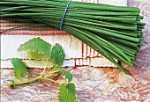 Bunch of chives and lemon balm branch, overhead view