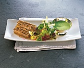 Jelly of beef with watercress on plate