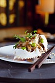 Close-up of clam meat with dill on plate