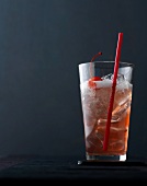 Royal Singapore Sling with cherry and ice in glass