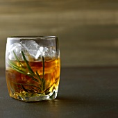 Rosemary with whiskey, rosemary and ice in glass