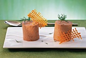 Orange chocolate mousse with dill on tray