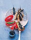 Fried sardines with tomatoes and pesto