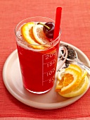 Fruit tea with orange and lemon in glass