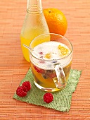 O'Berry punch with raspberries, orange, juice and champagne in cup