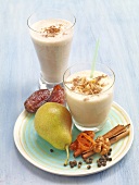 Flavoured dattelmilch and pear-walnut shake in glass