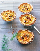 Seafood mini quiches on plates