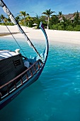 Traditional boat Dhoni at the coast of Dhigufinolhu island resort in Maldives