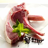 Lamb cutlets with herbs on tissue paper