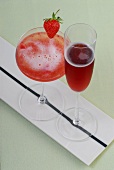 Summer drinks - Pretty woman and kir royal in glasses