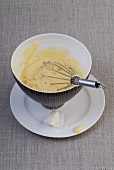 Homemade mayonnaise with whisk in bowl