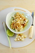 Marinated tofu with lime and lemon grass in bowl