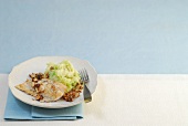 Cod fish with hazelnut and savoy cabbage puree on plate