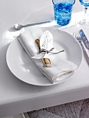 Place setting with name tag and clam