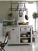Kitchen island with drawers and white hanging rondell