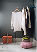 Different types of sweater on clothes rack