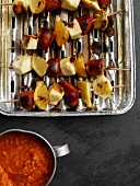Chorizo ??skewers with halloumi on a grilling plate