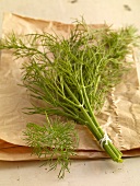 Bunch of dill on brown paper bag