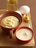 Close-up of mayonnaise, salad mayonnaise, mustard, eggs and oil