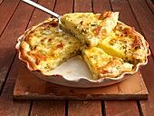 Quiche with basil cheese tart, spinach and leeks in serving dish