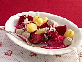 Beets, Potatoes dumpling and potatoes in serving dish