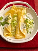 Stuffed pancake with leeks and cheese in serving dish