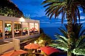 Guests dining at Quinta da Rochinha restaurant in evening, Ponta do Sol, Madeira, Portugal