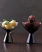 Two glasses of chocolates minzpralinen and herbal liqueur truffles