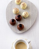 Cappuccino chocolates and coffee marzipan balls on plate