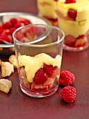 Saffron Tiramisu with raspberries and lychees in glass 