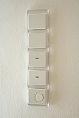 Safety switches in acrylic frame on white wall