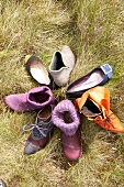 Seven different types of shoes in grass
