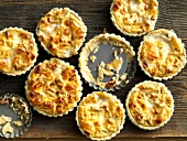 Crispy kasetarteletts in tartlet tins, overhead view