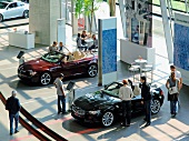 People at car exhibition in Munich, Germany, elevated view