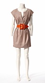 Gray colour mini dress with orange belt on mannequin against white background