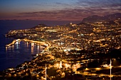 Aerial view of illuminated Funchal harbour and city at dusk, Madeira, Portugal