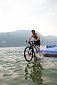 Man riding mountain bike in Lake Garda, Italy
