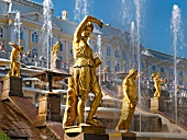 View of sumptuous bronze figures in front of Peterhof Palace in St. Petersburg, Russia