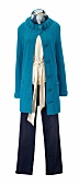 Knitted blue coat, beige blouse and jeans on mannequin against white background