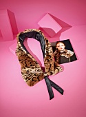 Animal printed plush scarf with photo on pink background