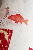 Red fish painted on white screen