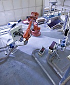 Elevated view of robot arm in grinder