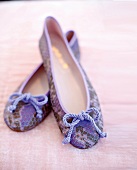 Close-up of purple and brown ballerinas