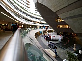 People at futuristic architectured Kanyon shopping mall in Istanbul, Turkey