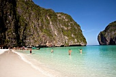 Tourists enjoying on beach at Ko Phi Phi Leh, Thailand